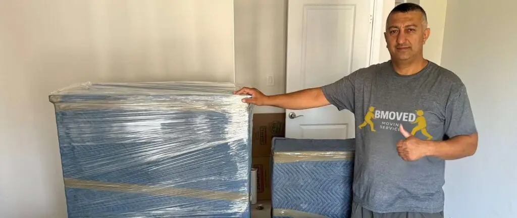Professional BMOVED movers receiving tip after successful Toronto move - tipping guide for moving services